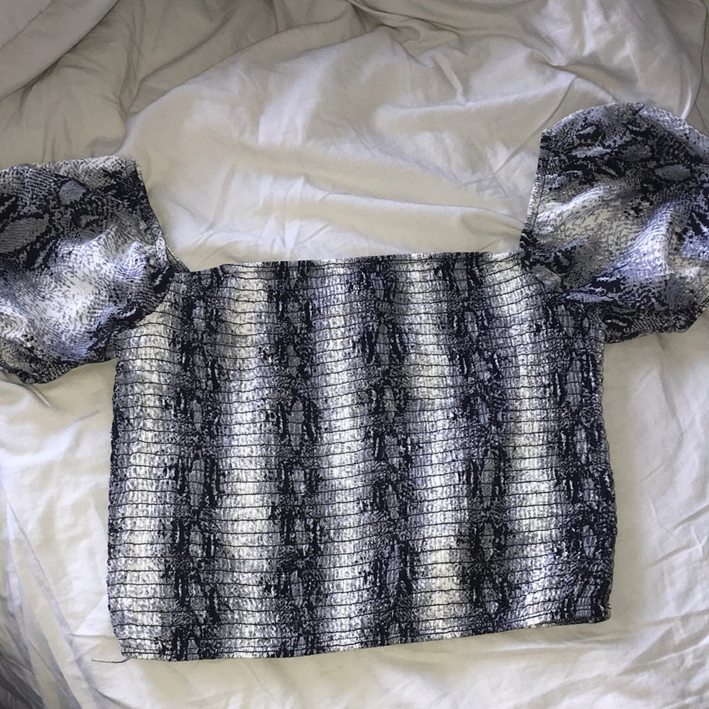 Snake skin printed off the shoulder crop top in the size large.